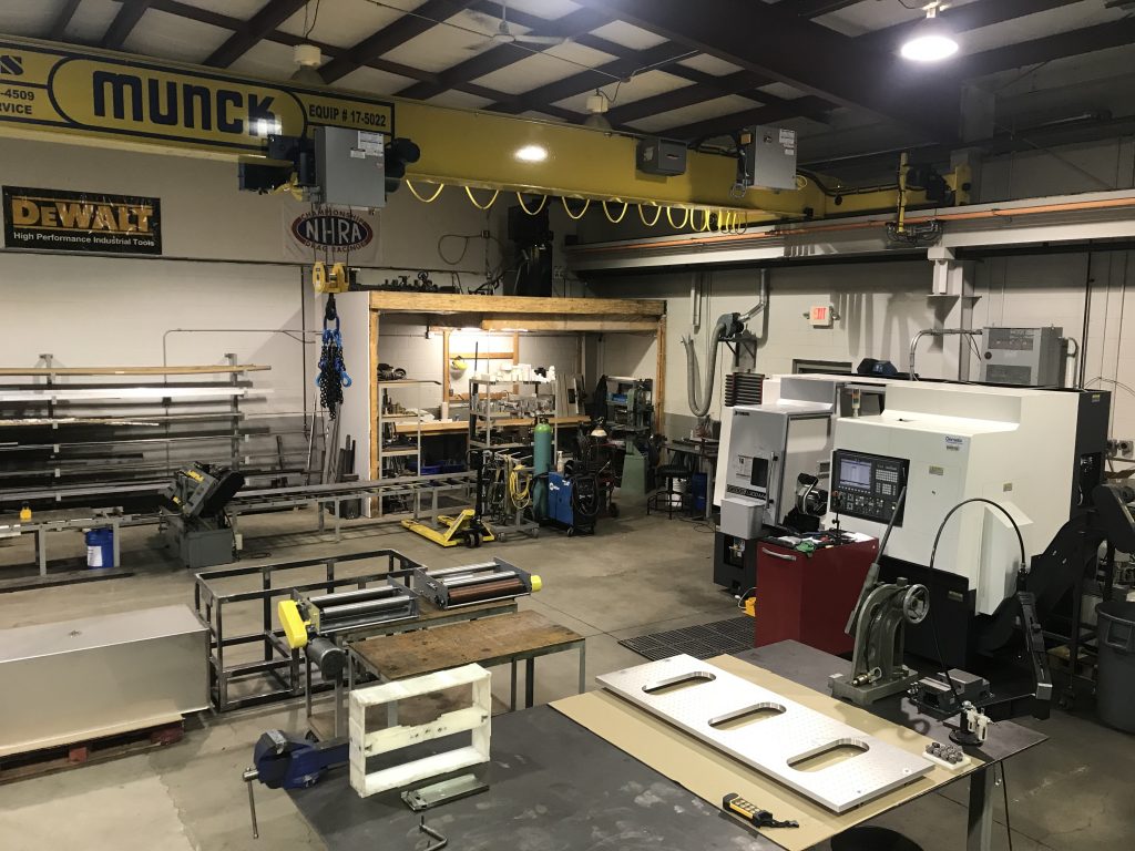 CNC machined components on the production floor at Custom Concepts Machining in Leamington, Ontario
