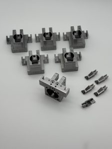 Machined clamp blocks for fixture plates in an automated assembly cell