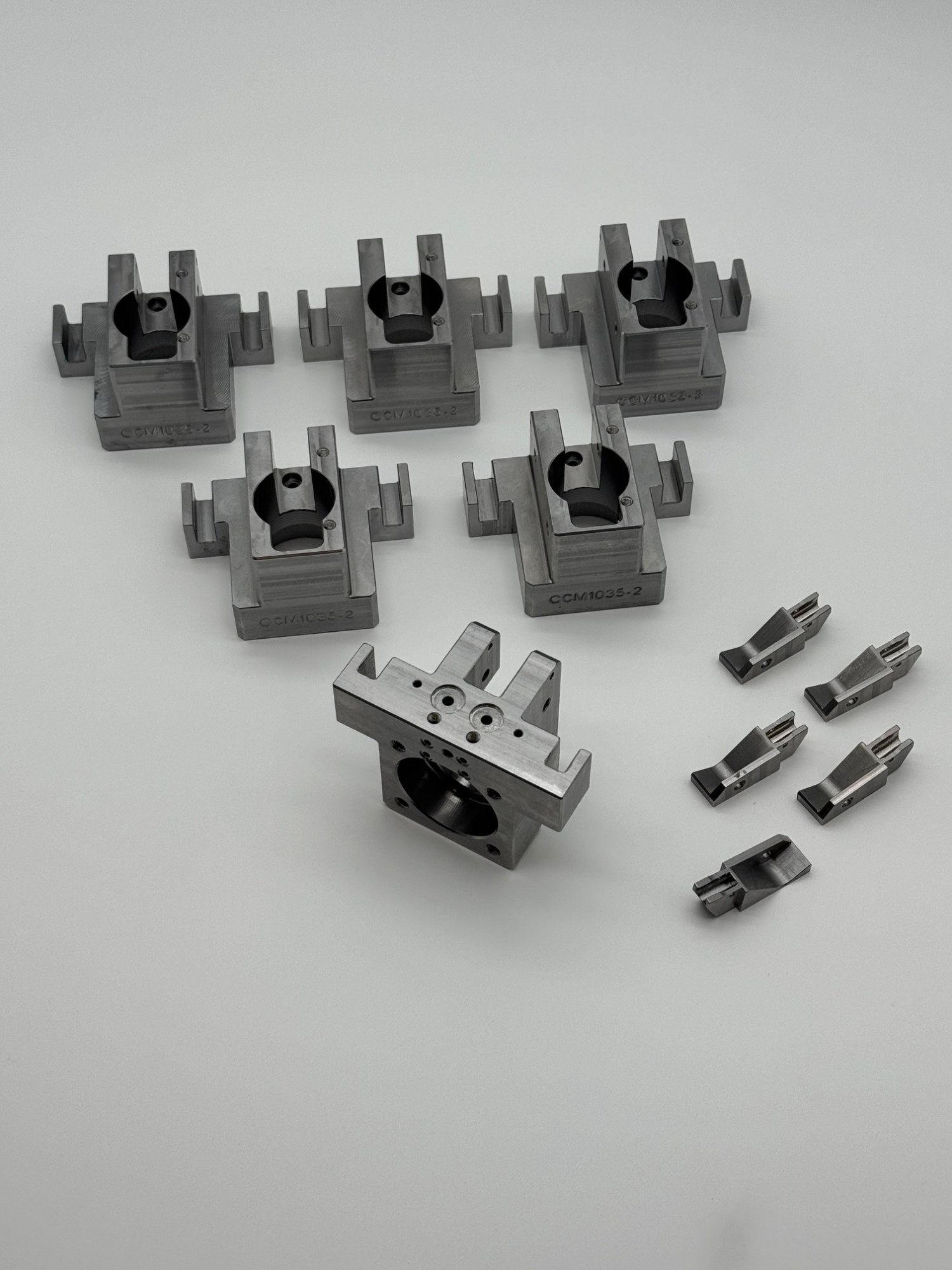 Machined clamp blocks for fixture plates in an automated assembly cell