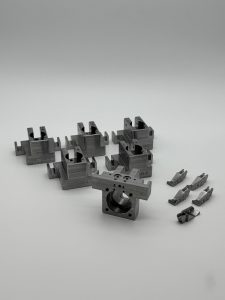 Machined clamp blocks for fixture plates in an automated assembly cell