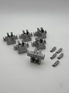 Machined clamp blocks for fixture plates in an automated assembly cell