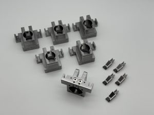 Machined clamp blocks for fixture plates in an automated assembly cell