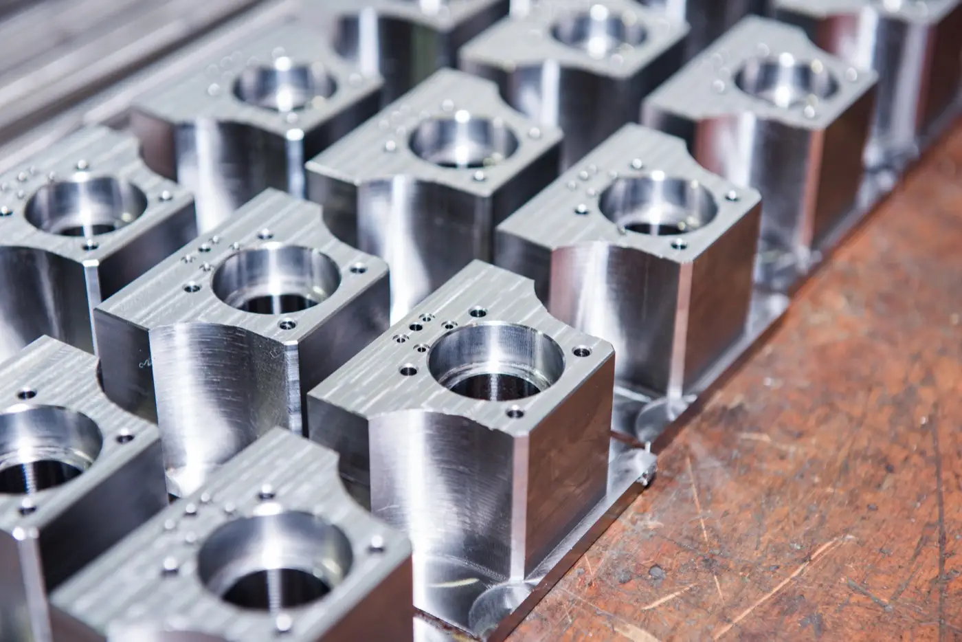 A batch of identical machined aluminum blocks