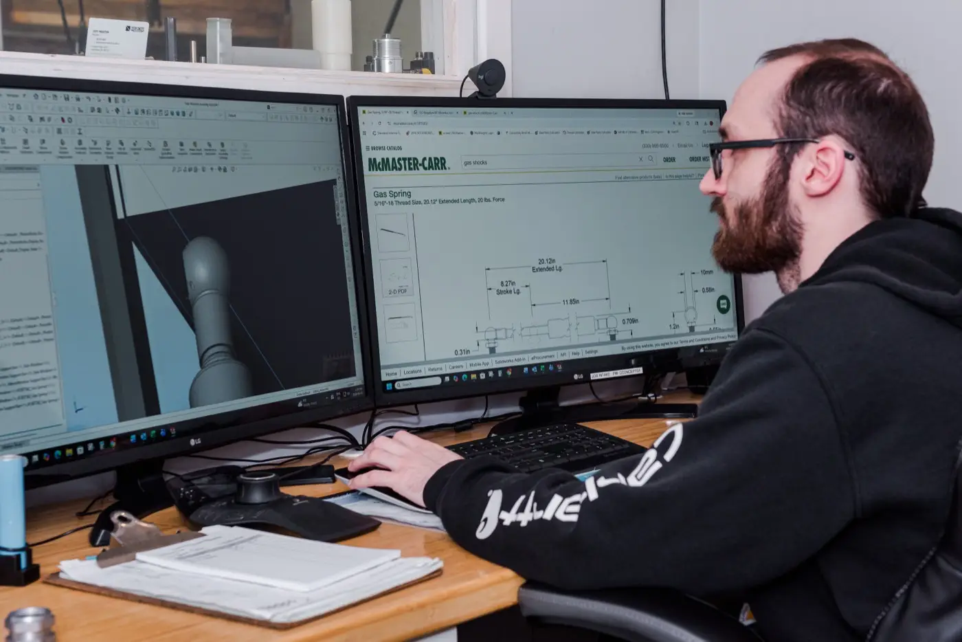 Designer working on a part in SolidWorks at Custom Concepts
