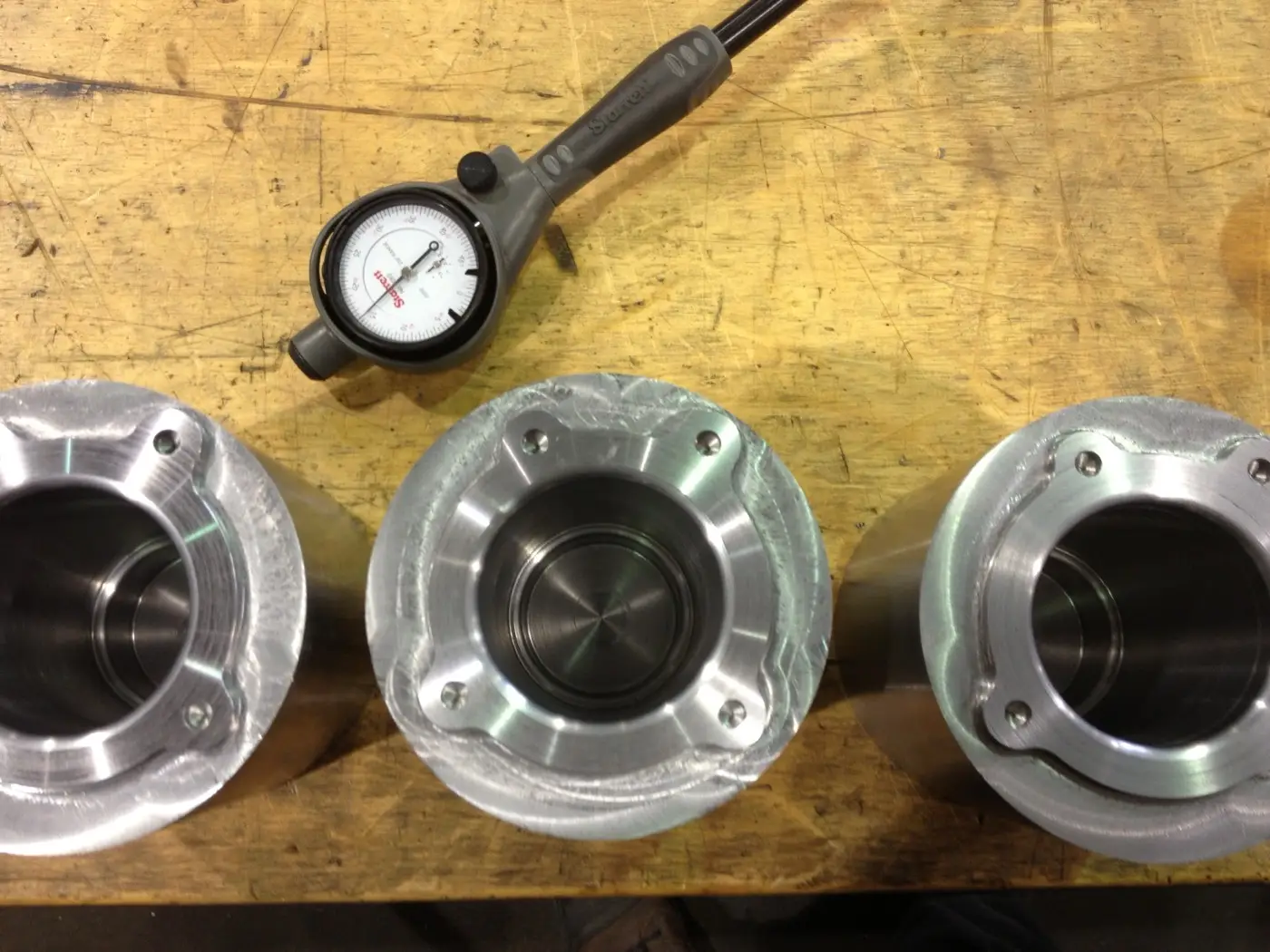 Checking a machined part with inspection tooling