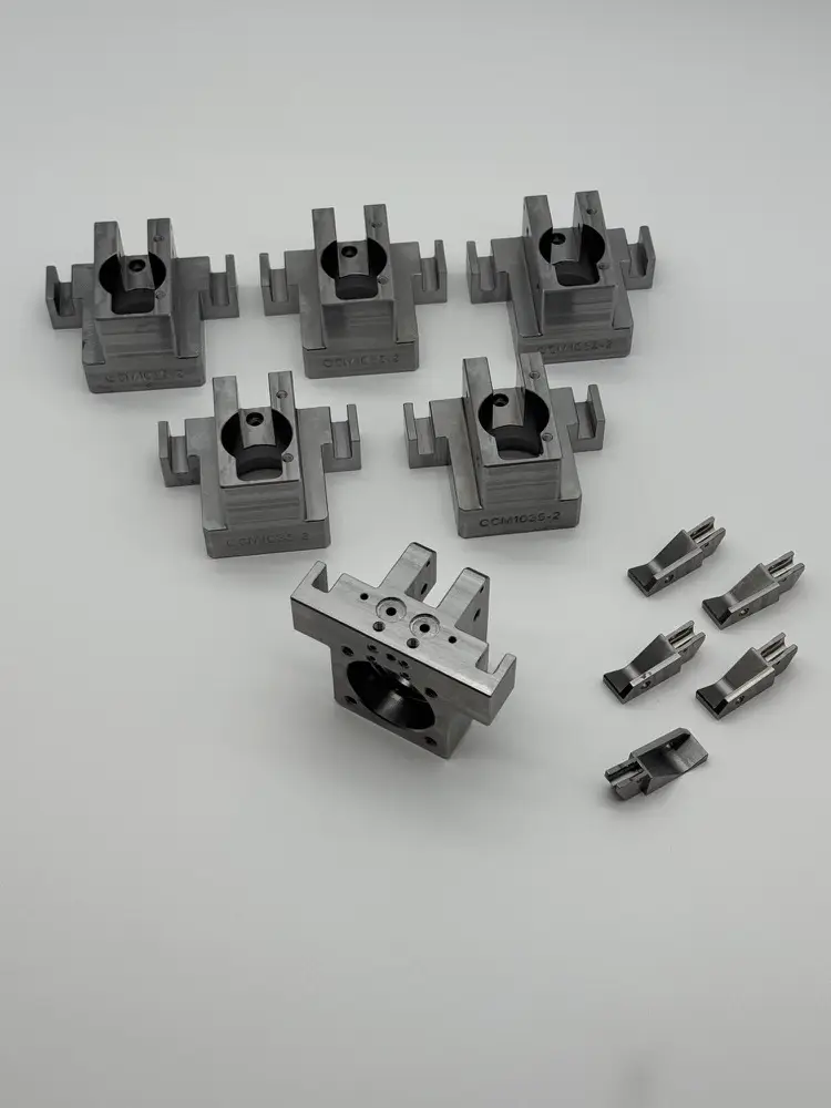 Machined clamp blocks for fixture plates in an automated assembly cell
