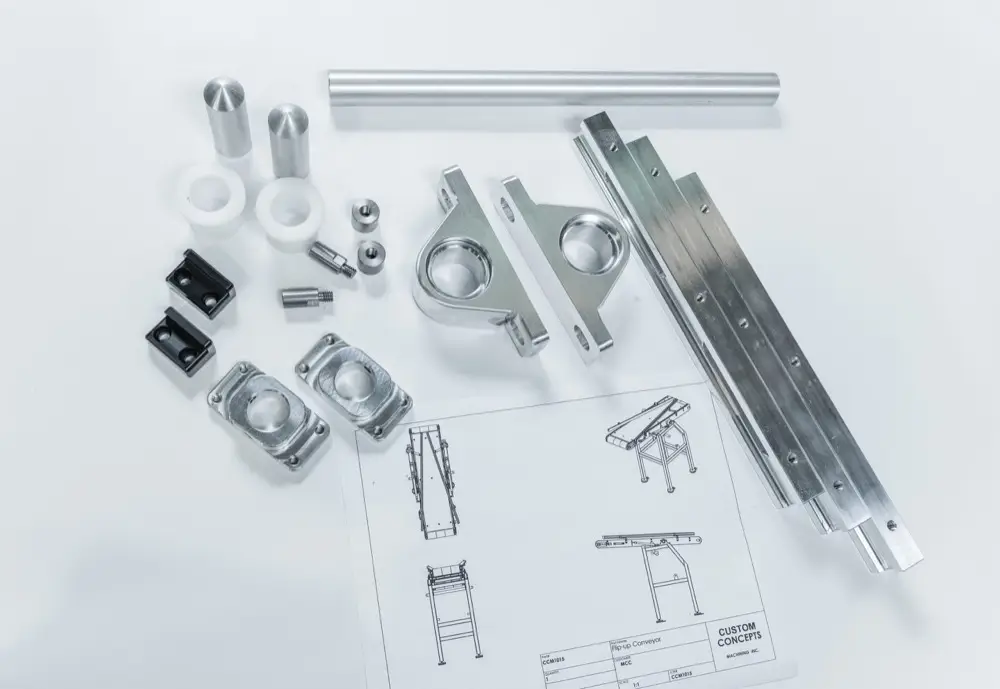 Machined components for a flip-up conveyor laid out with the drawing
