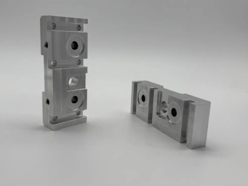 Machined rocker jogger blocks for a printing machine
